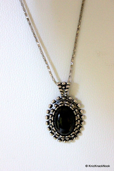Black and Silver Tone Pendant